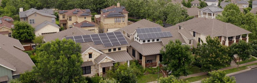 neighborhood with solar panels on homes